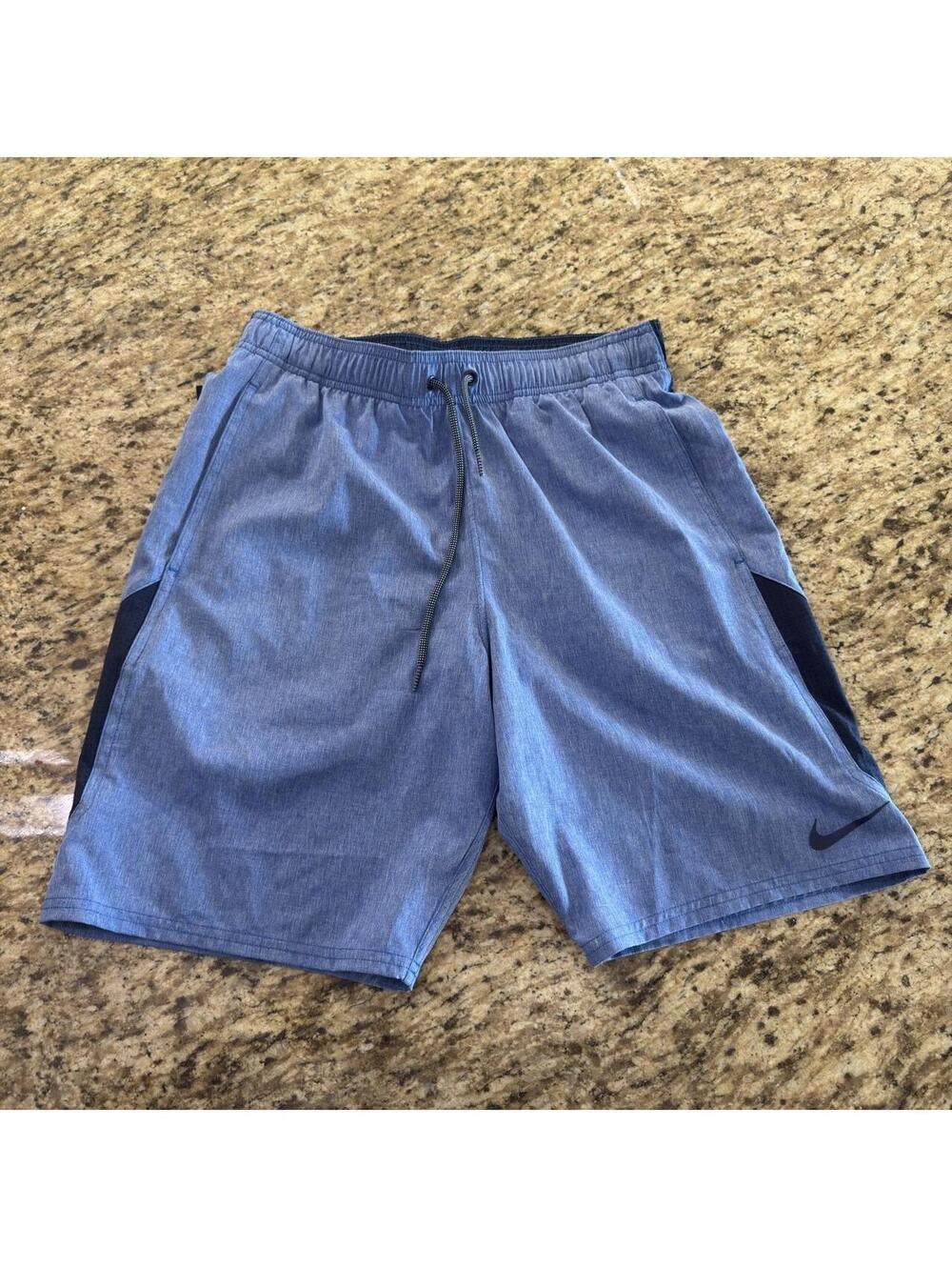 Nike blue swim shorts with black side panels #athletic #sportswear